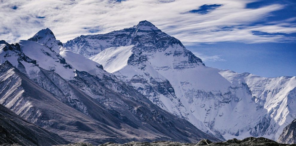 snow covered mountains under blue sky during daytime