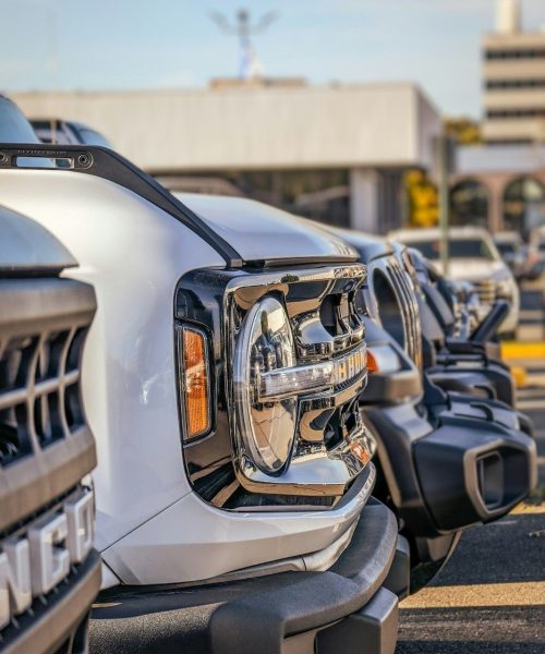 a row of parked cars in a parking lot